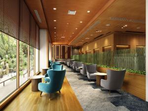 a row of chairs and tables in a waiting room at ANA Crowne Plaza Kochi by IHG in Sagamichō