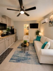 a living room with a couch and a ceiling fan at The Arlington Hideaway in Jacksonville