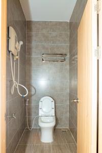 a bathroom with a toilet and a shower at Khách sạn Caravelle Cần Thơ 2 in Can Tho