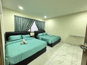 a bedroom with two beds and a window at Tanjung Tuan Beach Regency - Hermis Theme 1 Car Park in Kampong Baharu +48 photos
