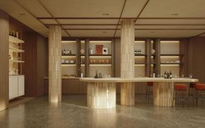 a large room with columns and a table in a building at DoubleTree by Hilton Madrid Principe de Vergara in Madrid
