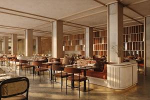 a restaurant with tables and chairs in a room at DoubleTree by Hilton Madrid Principe de Vergara in Madrid