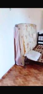 a bedroom with a bed in a room at Wana Soeiro in Marapanim