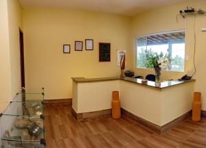 a waiting room with a counter and a window at Pousada Bela Vista in Conde +123 photos
