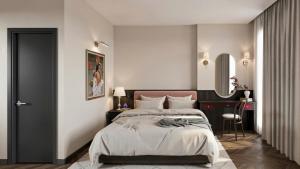 a bedroom with a bed and a desk and a mirror at LoverA Signature Hotel in Ho Chi Minh City
