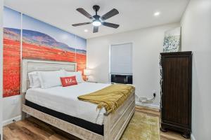 a bedroom with a bed and a ceiling fan at New Riverside Fire Pit 3BR 2.5 bath in Brewer