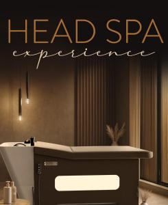 a bathroom with a head spa experience sign above a sink at La Chioma di Berenice in Celano