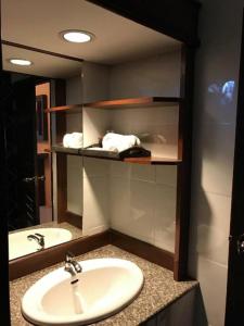 a bathroom with a sink and a mirror at Tong Hotel in Ban Nong Chik +23 photos
