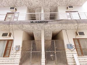 a building with a sign that reads mhm homogeneity at ML HOMESTAYS - For Family, Students, Parents, Couples in Phagwāra