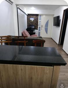 a living room with a table and a couch at Casa de alejo in Pereira
