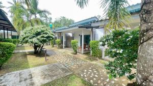 a house with a walkway in front of it at Smile Resort Koh Mook in Ko Mook