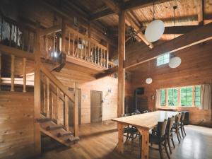a dining room with a wooden table and chairs at #65 Stella 八ヶ岳姫木平 in Tateshina +67 photos