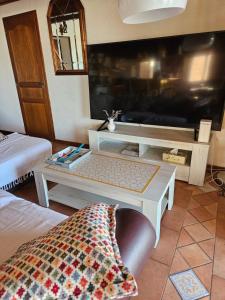 a living room with a couch and a table at Mas Saint Jean in Arles
