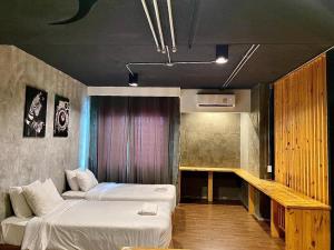 a room with two beds and a couch in it at Southern View Hotel Pattani in Ban Ru Sa Mi Lae +32 photos