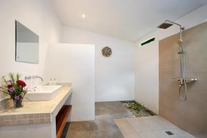 a bathroom with a sink and a shower at Villa Panoramic in Nusa Penida +24 photos