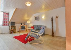 a living room with a couch and a table at Landhotel zum Metzgerwirt in Bayersoien