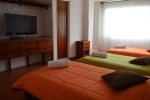 Postel nebo postele na pokoji v ubytování Hotel Dancar