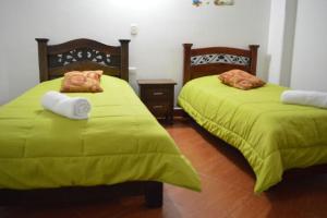 Postel nebo postele na pokoji v ubytování Hotel Dancar