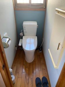 a small bathroom with a toilet in a room at Kusatsu KOTODAMA in Kusatsu +20 photos