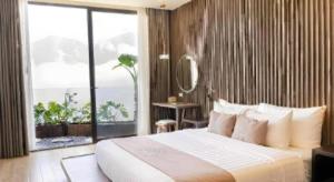 a bedroom with a large bed and a large window at Viettrekking Sapa in Lo Sui Tong +174 photos
