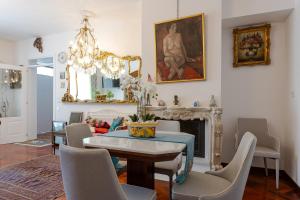 a living room with a table and a fireplace at Casa Bianca in Silvi Marina