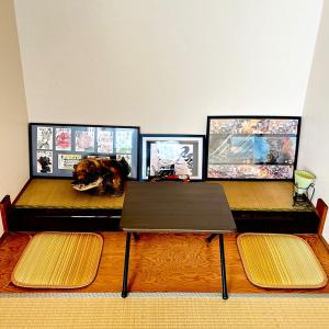 a room with three tables and three pictures on the wall at Makeit 1to3 - Vacation STAY 17356 in Chichibu