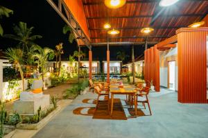 an outdoor patio with a table and chairs at The Siantar Luxury Villa And Spa in Nusa Penida