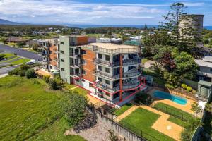 an aerial view of an apartment building with a pool at Karingal in Nambucca Heads