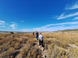 a group of people walking on a hill at Under Stars in Nebeur