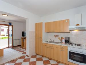 Kuchyň nebo kuchyňský kout v ubytování Apartments AVA