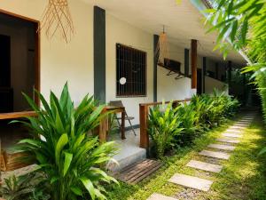 a courtyard of a house with a table and plants at Pascoe's Units Siargao- Suites in General Luna