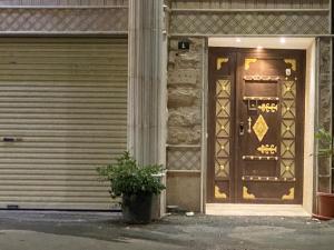 a door to a building with a plant in front of it at كازا in Taif +10 photos