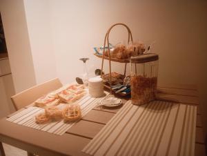 a table with bread and a basket of food on it at Sabry holiday Terrasini in Terrasini