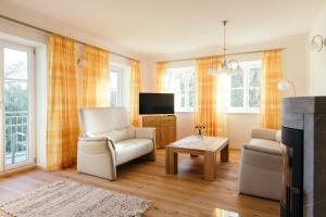 Telewizja i/lub zestaw kina domowego w obiekcie Ferienwohnung Mayrhofer