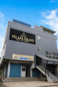 a building with a sign that reads slow stay inn at Vilasa Prime Hotel in Guwahati