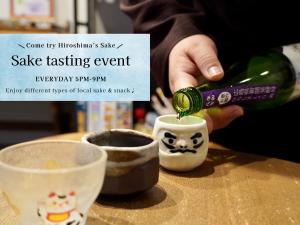 a person is pouring a potion into a sake tasting event at LAZULI Hiroshima Hotel and Lounge in Hiroshima +89 photos