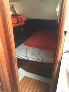 a small room with a small bed in it at Puerto Calero Boat in Puerto Calero