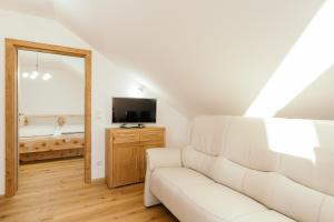 Telewizja i/lub zestaw kina domowego w obiekcie Ferienwohnung Mayrhofer