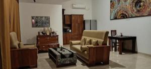 a living room with a couch and a chair at Nature villas Bentota in Bentota