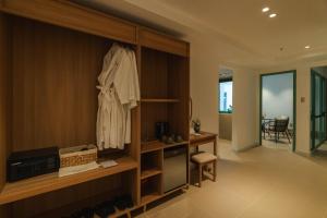 a room with a closet with a robe on it at dei Balconi Dalat in Ấp Ða Lợi +127 photos