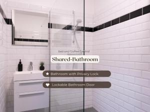 a bathroom with a shower and a sink at Budget-Friendly Room Tilburg Center Prime Loc in Tilburg