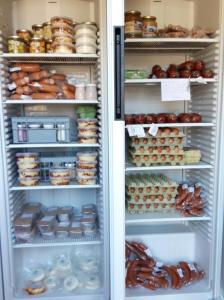 an open refrigerator filled with lots of food at Stadtbauernhof Salzburg - Ferienwohnung - Gut Unterleithen - farm & the city in Salzburg