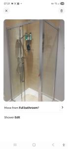 a shower with a glass door in a bathroom at Spacious Luxury Room in Brixham