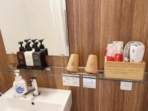a bathroom with a sink and a mirror at 灯光旅館 Light hotel in Tokyo +137 photos