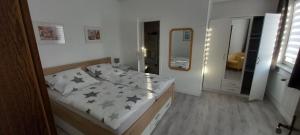 a bedroom with a bed with black stars on it at Gästehaus Wetzel in Braunlage