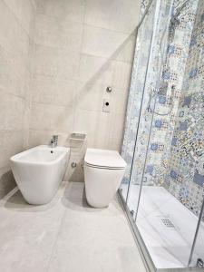 a bathroom with a toilet and a shower and a sink at Hotel Campion CityLife in Milan +37 photos