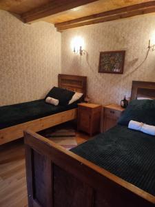 a room with two beds in a room with at Glas house Aljmaš in Aljmaš +20 photos