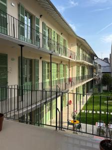 an external view of a building with a courtyard at Flore Hôtel & Jardin The Originals Relais in Vichy