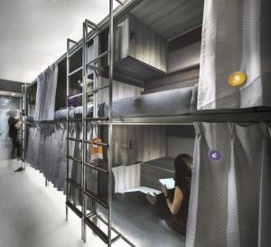 a group of bunk beds in a room at Coller Boutique Hostel in Singapore