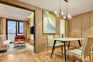 a dining room with a table and chairs at Hyatt Place Shanghai Lingang in Zhenghai